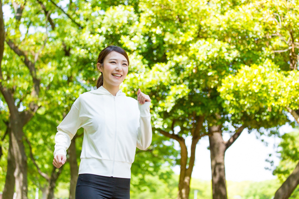 young asian woman running in the park